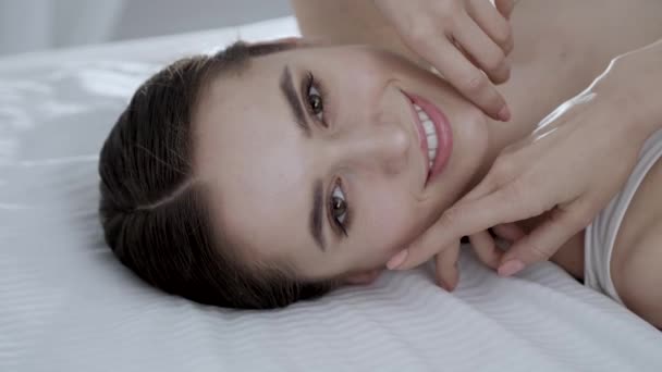 Face Care. Young Woman Lying On Bed And Touching Skin On Face — Stock Video