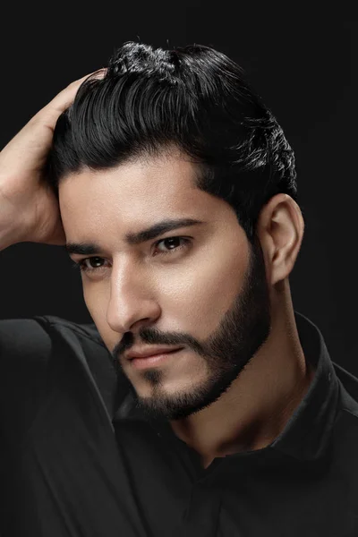 Men Hair Beauty. Handsome Male Model Touching Healthy Hair