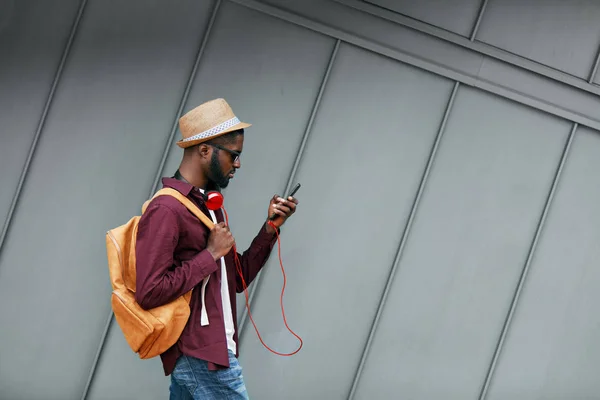 Handsome Black Man In Fashion Clothes With Phone On Street