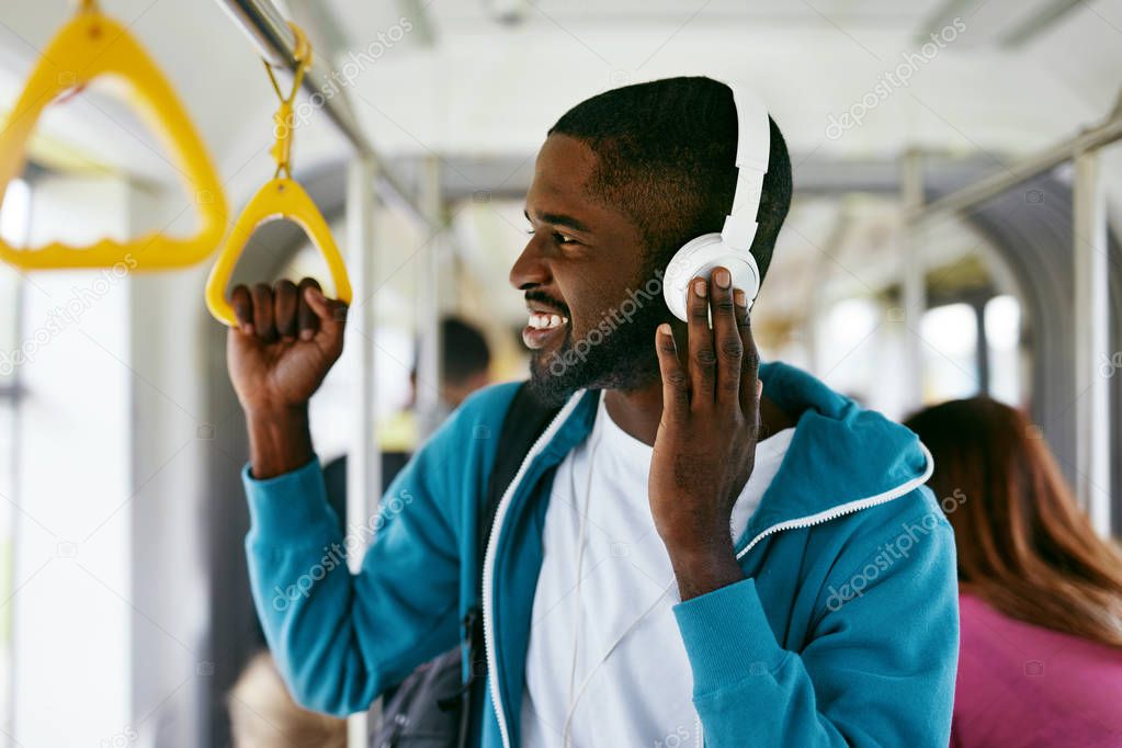 Man In Headphones Listening Music Riding In Transport