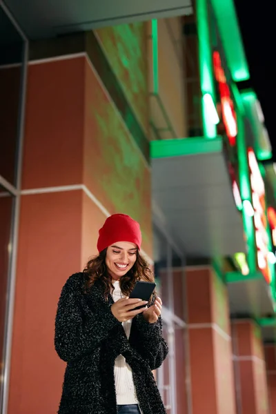 Happy Woman With Phone On Street In Evening