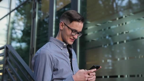 Man Using Mobile Phone Near Office Building — Stock Video