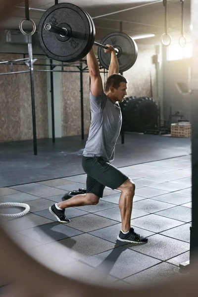 Sports Man Lifting Barbell Row At Workout Gym — Stock Photo, Image