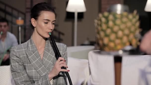 Woman Smoking Pineapple Shisha At Hookah Lounge — Stock Video