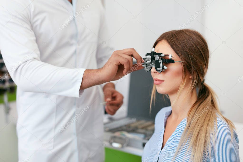 Eye Exam. Woman In Glasses Checking Eyesight At Clinic