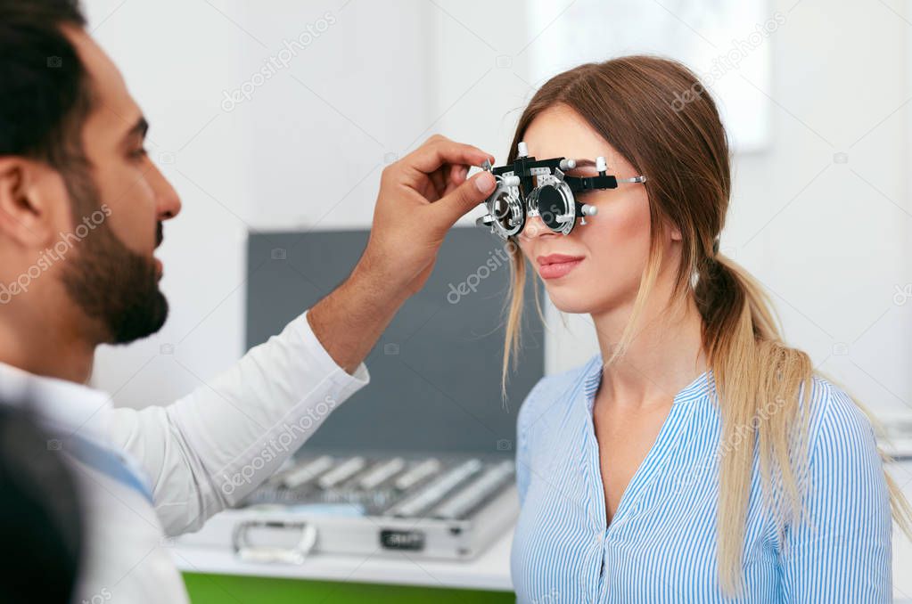 Optometry Test. Eye Doctor Checking Woman Eyesight At Clinic