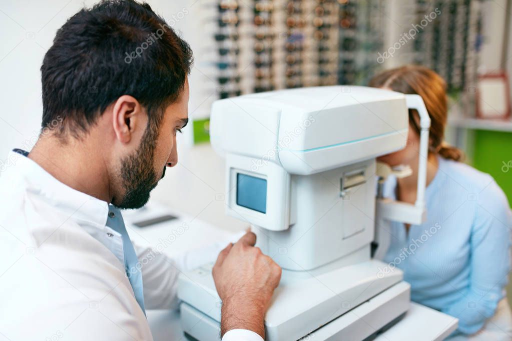 Eye Test. Optometrist Testing Woman Eyesight On Modern Equipment