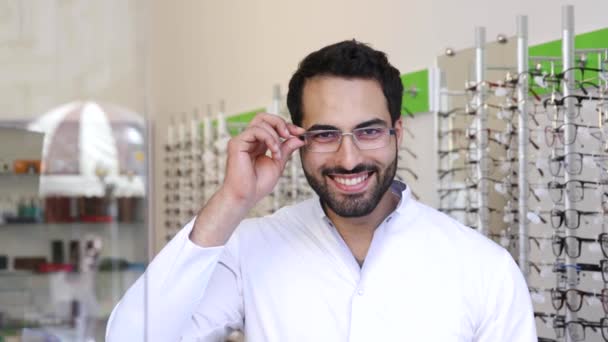 Optician Doctor Near Showcase With Eyeglasses At Glasses Shop — Stock Video