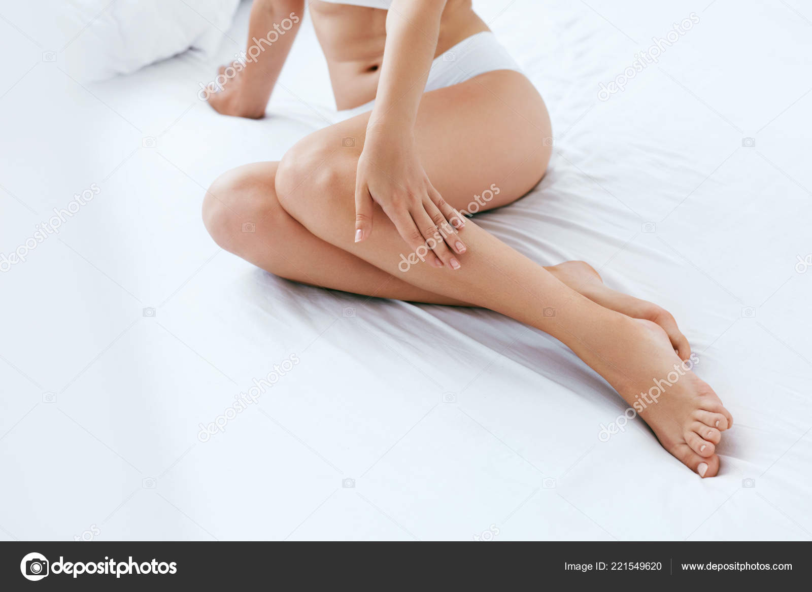 Long Woman Legs With Beautiful Smooth Skin. Closeup Of Female Hand