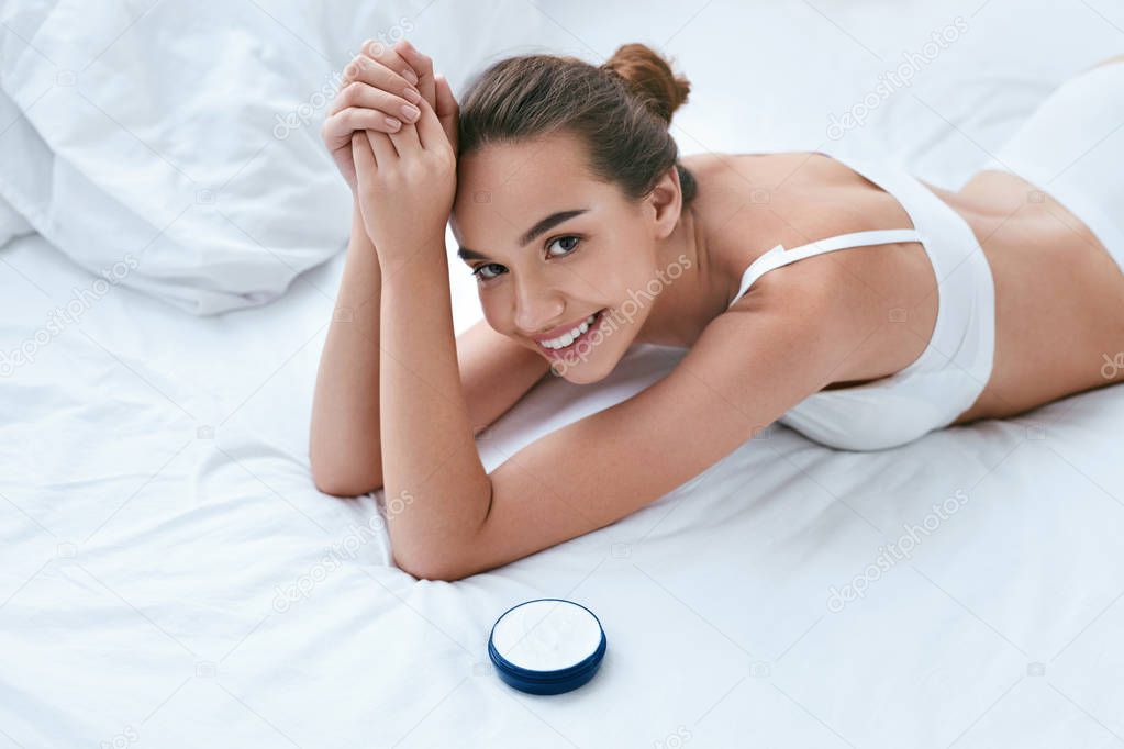 Woman Body Skin Care. Beautiful Smiling Girl With Cream