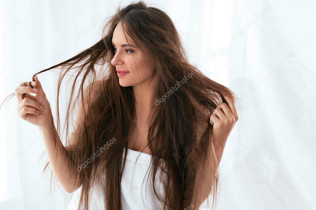 Hair Problem. Woman With Dry And Damaged Long Hair