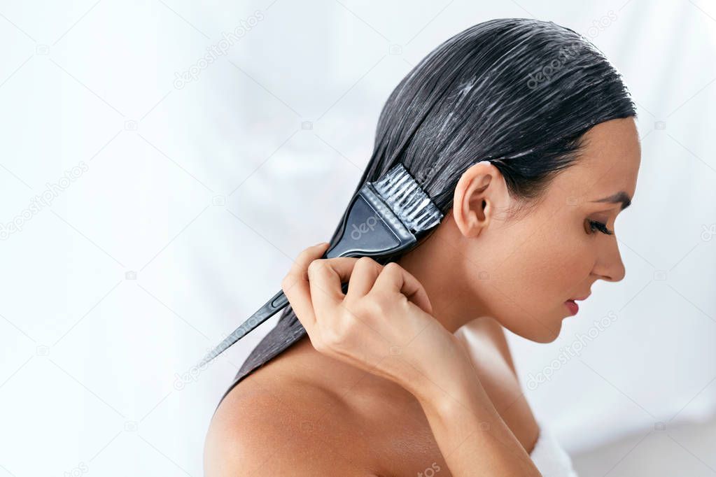Hair Mask. Woman Applying Conditioner On Long Hair With Brush, Hair Care Treatment