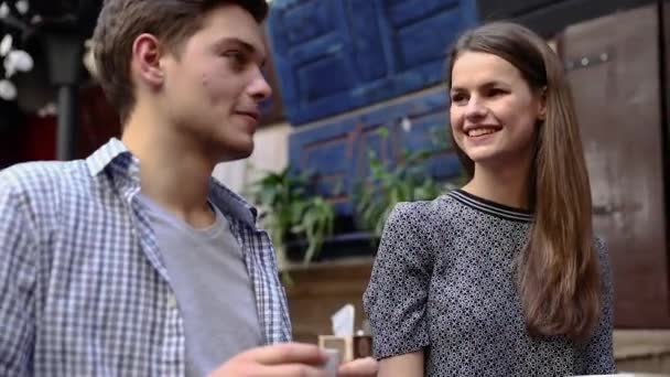 Couple In Cafe. Young People Drinking Coffee And Communicating — Stock Video