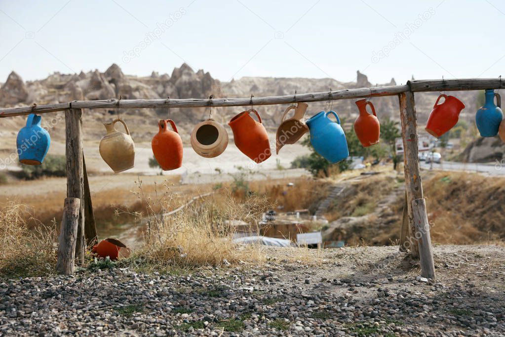 Countryside. Colorful Old Jugs Hanging In Yard