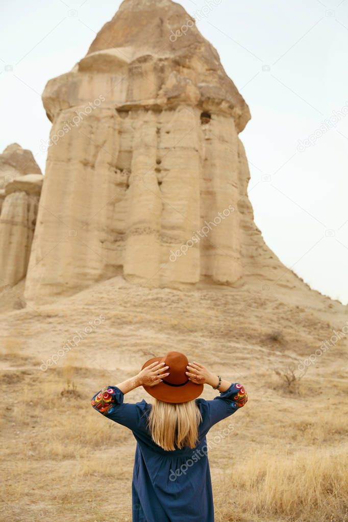 Travel. Beautiful Woman In Dress And Hat Traveling At Nature