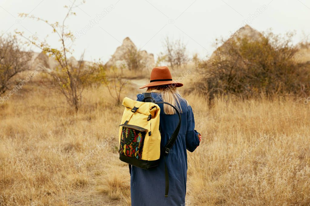 Travel. Woman Traveling With Backpack At Field