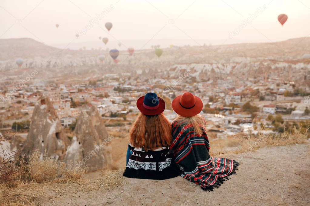 People Travel. Women In Hats On Hill Enjoying Flying Balloons