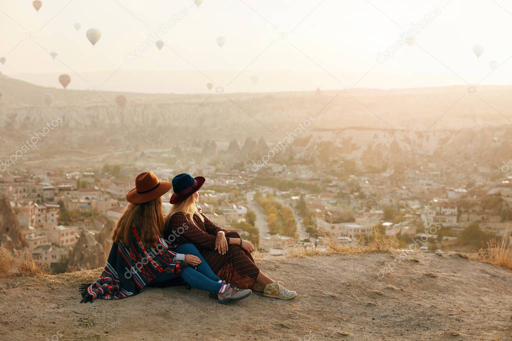 People Travel. Women In Hats On Hill Enjoying Flying Balloons