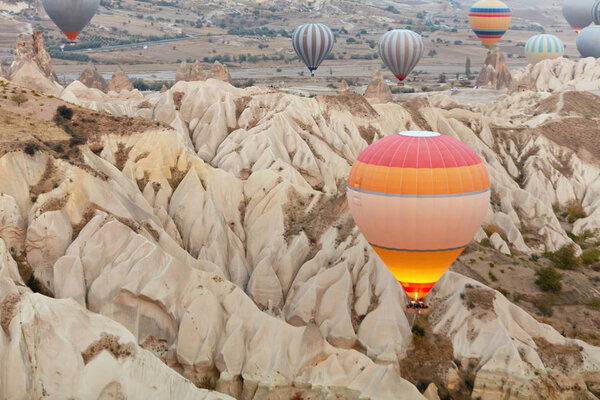 Colorful Hot Air Balloons Flying In Sky Above Mountains