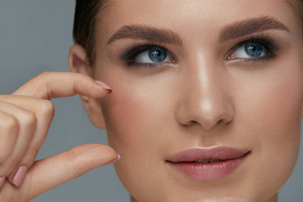 Beauty face makeup. Woman with beautiful eyes and eyebrows