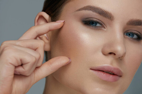 Beauty face makeup. Woman with beautiful eyes and eyebrows