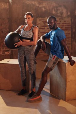 Fitness couple in sport clothes after workout at gym portrait clipart
