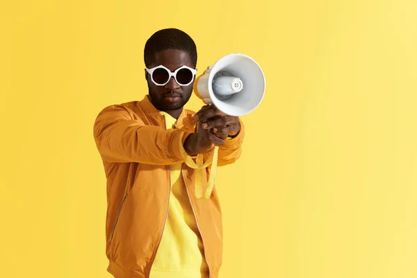 Black man in fashion sunglasses with megaphone portrait — Stock Photo, Image