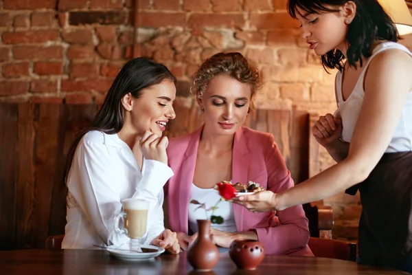 Confectionery. Women Tasting Chocolate Candy In Cafe. — Stock Photo, Image