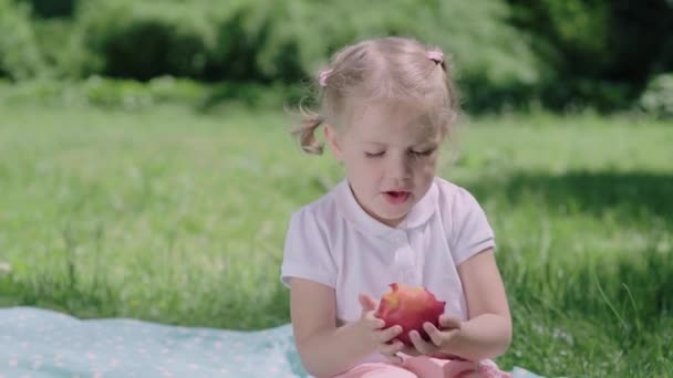 Healthy Nutrition. Child Eating Juicy Apple Outdoors — Stock Video