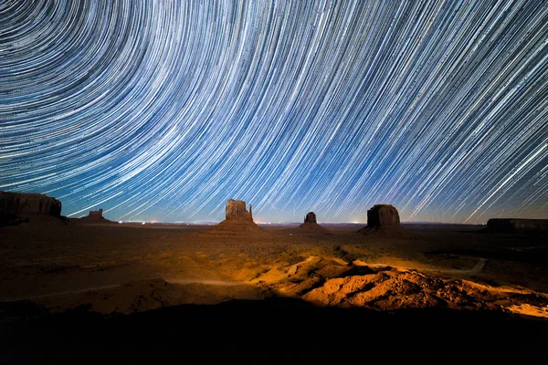 Monument Valley with stars trails in long exposure, Arizona, USA.