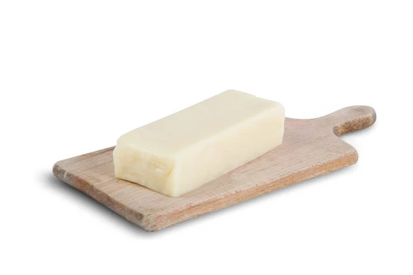 在白色背景查出的木板上的一块奶酪 — 图库照片
