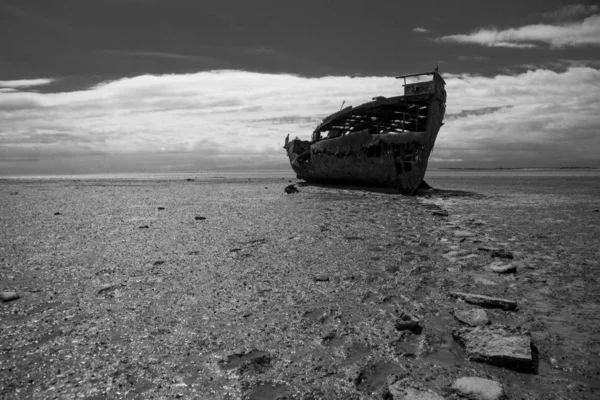 Old rusty boat at seashore