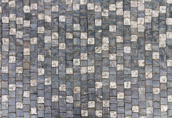 Granite cobblestoned pavement background with regular design