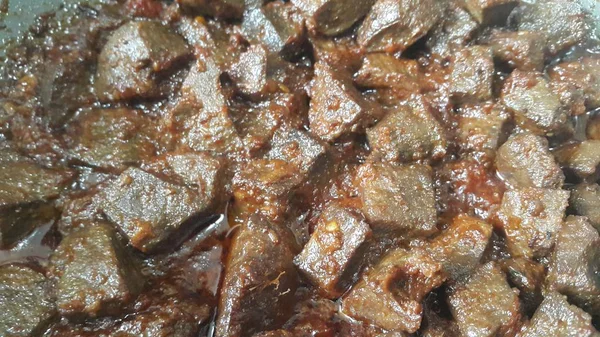 A close up view of Stewed chicken liver withspices  on it, a traditional home made delicious liver dish
