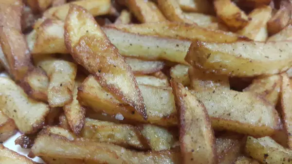 Rodajas Fritas Asadas Patata Sobre Fondo Limpio Con Espacio Copia — Foto de Stock