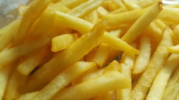 Close-upweergave van aardappel frietjes of geroosterde plakjes — Stockfoto