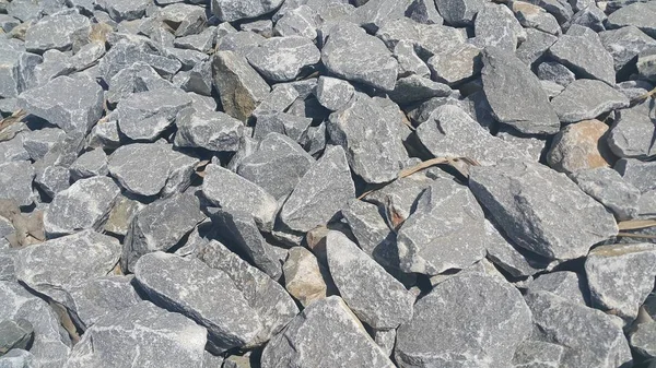 Fondo de textura: guijarros de roca, pequeños, redondeados, guijarros lisos — Foto de Stock