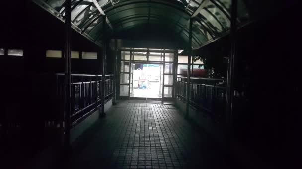 Bright light from coming from a dark building at night time — Stock Footage Bright light from coming from a dark building at night time Royalty Free Stock Video