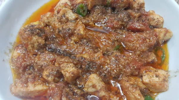 A close up view of stewed chicken meat cubes with spices on it — Stock Photo, Image