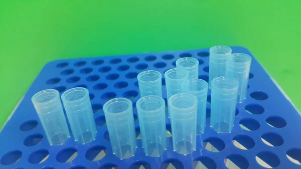 Close up view of blue micro litre tips in microtip box with empty holes. — Stock Photo, Image