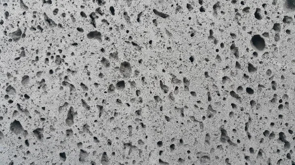 Grey color floor background with drak grey hole shapes