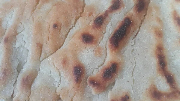 Jawar RotiまたはBhakriと呼ばれる伝統的なパンのクローズアップビュー 八切り ばかり 多くのアジア諸国の料理によく用いられる丸みを帯びた平パンである — ストック写真