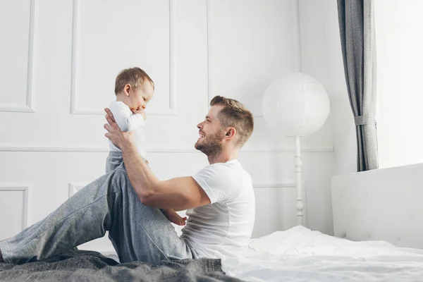 Happy Father His One Year Old Son Playing Home Bed — Stock Photo, Image