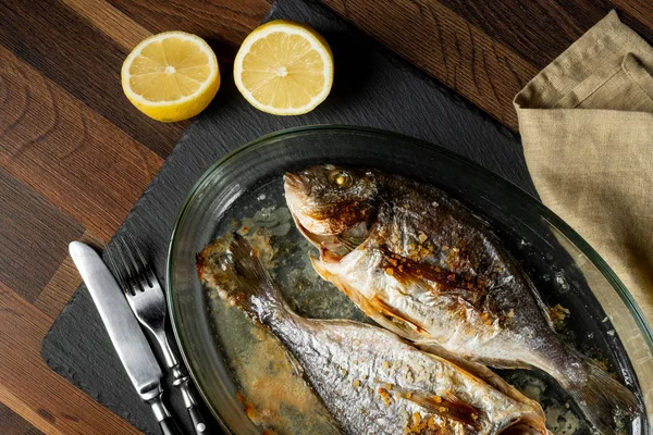 Baked Sea Fish Seasoning Baking Pan Wooden Table — Stock Photo, Image