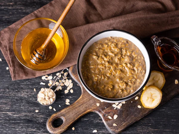 Homemade Oatmeal Served Honey Banana Slices Wooden Board — Stock Photo, Image