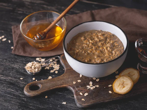 Homemade Oatmeal Served Honey Banana Slices Wooden Board — Stock Photo, Image