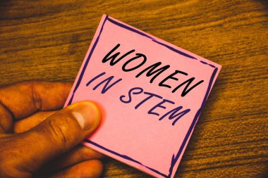 Kadınlar içinde kök gösterilen Not yazma. Bilim Teknoloji Mühendislik Matematik bilim adamı araştırma vitrine iş fotoğraf