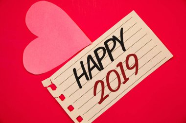 Text sign showing Happy 2019. Conceptual photo New Year Celebration Cheers Congrats Motivational MessageNotebook page red background Pink Heart Black letters Love note romantic clipart