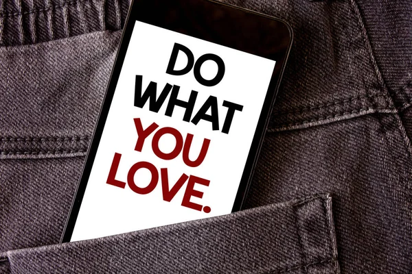 Writing note showing Do What You Love.. Business photo showcasing Positive Desire Happiness Interest Pleasure Happy Choice Words written black Phone white Screen Back pocket grey jeans trousers