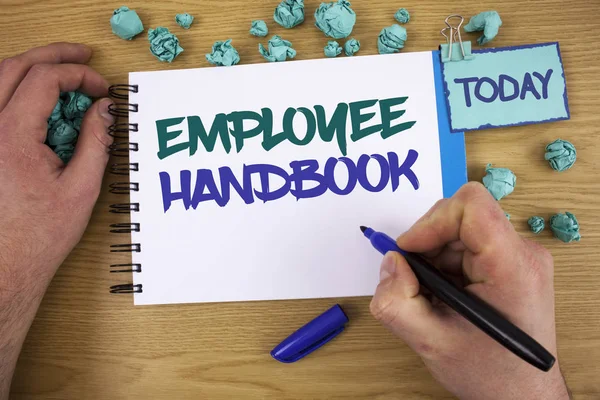 Writing note showing  Employee Handbook. Business photo showcasing Document Manual Regulations Rules Guidebook Policy Code Text two words blue white notepad blue marker hand crumbled blue paper